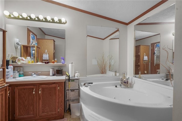 bathroom with ornamental molding, vanity, a textured ceiling, and a tub to relax in