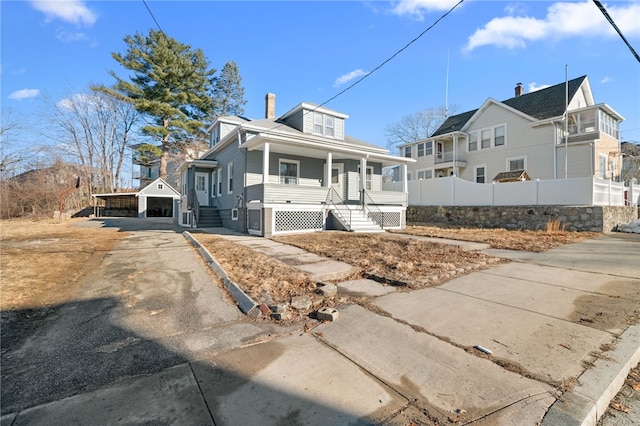 view of front of home with a garage and a porch