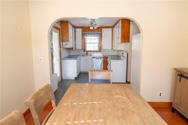 kitchen with white cabinetry, white electric range oven, sink, tasteful backsplash, and dishwasher