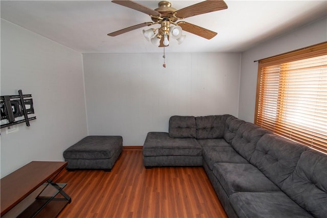 living room featuring dark hardwood / wood-style floors and ceiling fan