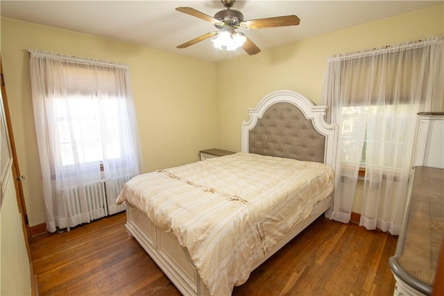 bedroom featuring ceiling fan and dark wood-type flooring