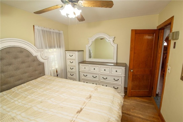 bedroom with hardwood / wood-style flooring and ceiling fan