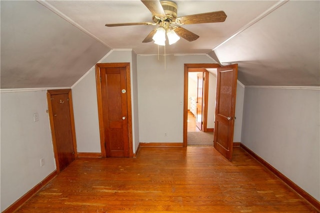 additional living space featuring ceiling fan, lofted ceiling, and wood-type flooring