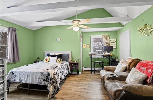 bedroom with a baseboard radiator, vaulted ceiling with beams, ceiling fan, and light hardwood / wood-style flooring