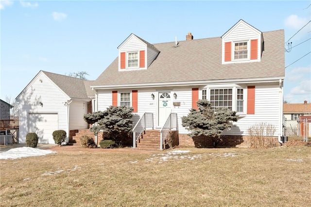 cape cod-style house featuring a garage and a front yard