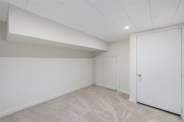 basement with light colored carpet