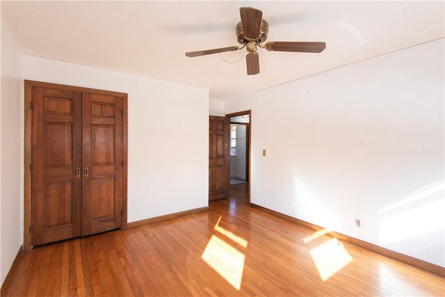 unfurnished bedroom featuring ceiling fan and light hardwood / wood-style flooring