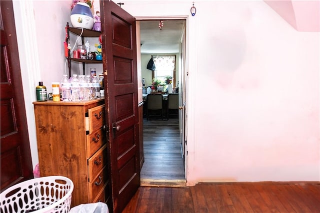 hallway featuring dark wood-type flooring