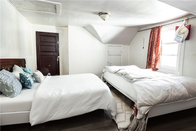 bedroom featuring lofted ceiling