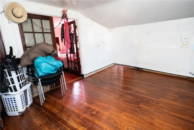 bonus room featuring lofted ceiling and dark hardwood / wood-style flooring