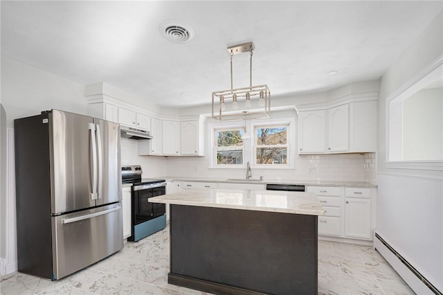 kitchen with appliances with stainless steel finishes, hanging light fixtures, white cabinetry, and a baseboard radiator