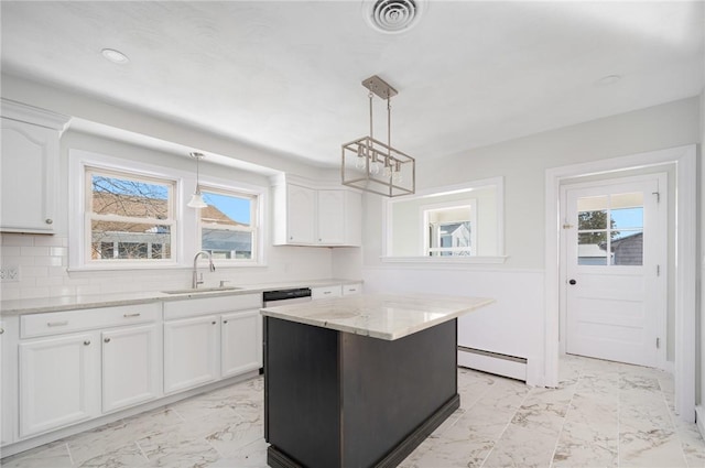 kitchen featuring white cabinetry, hanging light fixtures, a kitchen island, baseboard heating, and sink