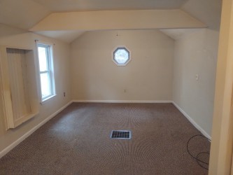 bonus room featuring vaulted ceiling, baseboards, and carpet
