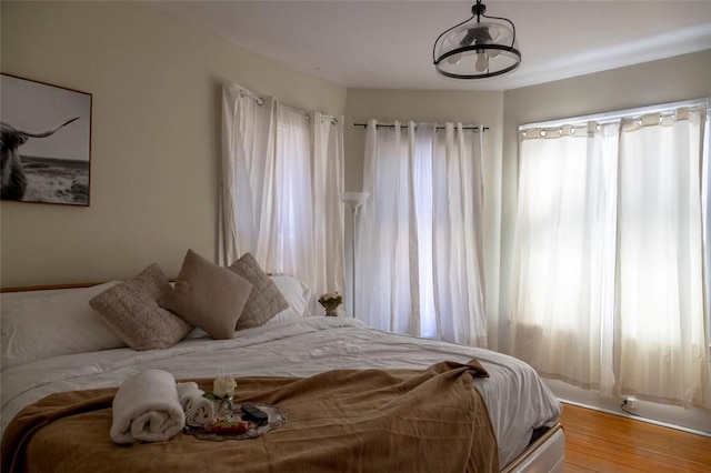 bedroom with hardwood / wood-style flooring