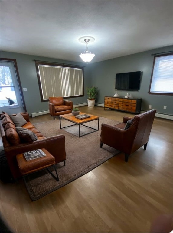 living room with light hardwood / wood-style floors and baseboard heating