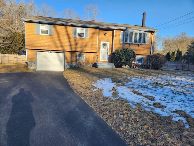 split foyer home featuring a garage