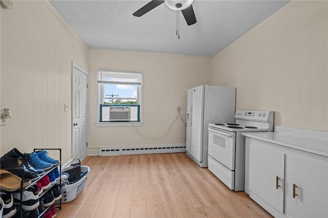 kitchen featuring light hardwood / wood-style flooring, cooling unit, baseboard heating, white appliances, and ceiling fan