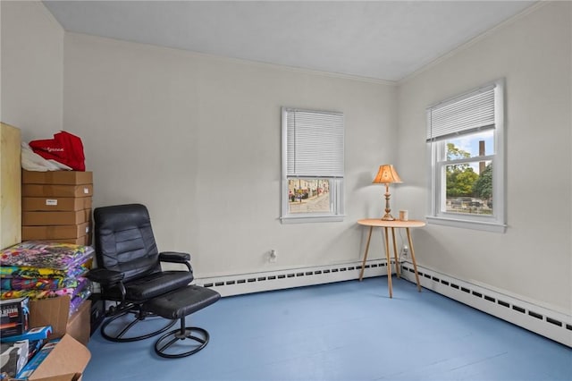 living area featuring ornamental molding and a baseboard heating unit