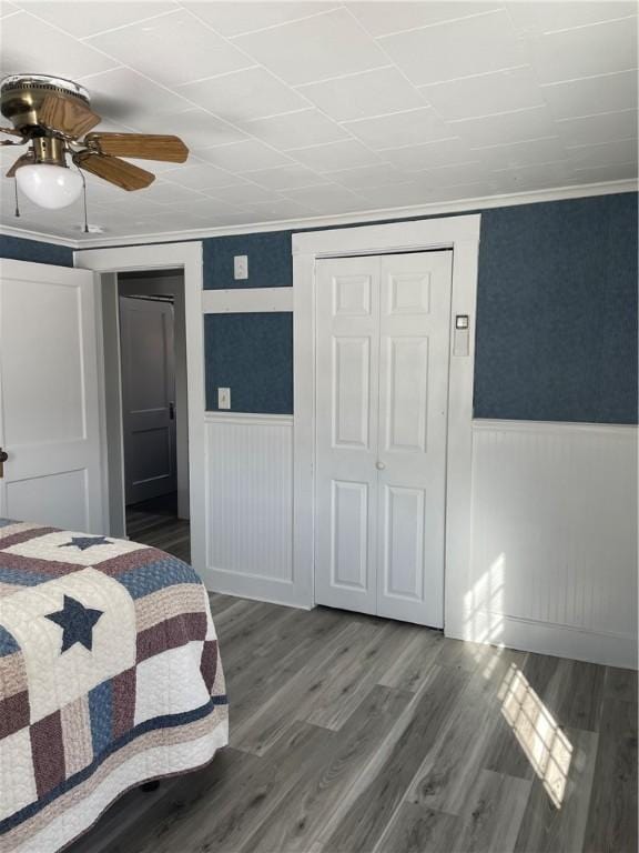 840 S Main St, Burrillville, RI 02859 - bedroom with a wainscoted wall, ornamental molding, wood finished floors, a closet, and ceiling fan