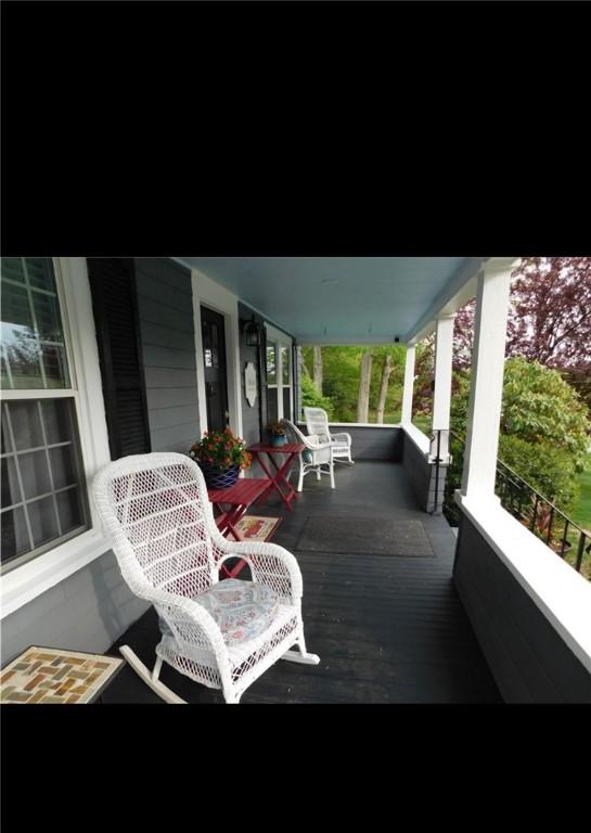 wooden terrace with a porch