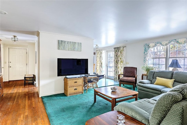 living room with baseboards and wood finished floors