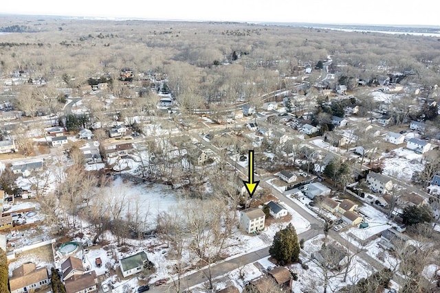 snowy aerial view with a residential view