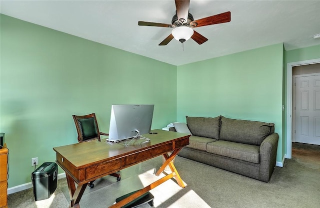 office area featuring ceiling fan, carpet, and baseboards