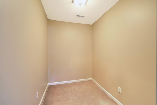 unfurnished room with light carpet, baseboards, and visible vents