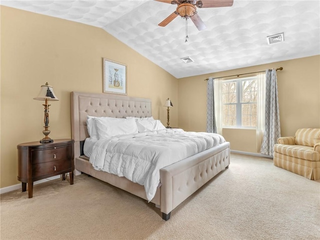 bedroom with visible vents, light carpet, and vaulted ceiling