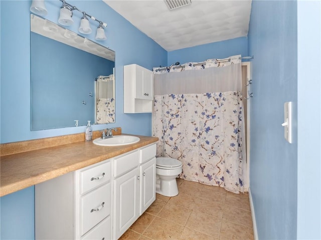 bathroom featuring visible vents, toilet, a shower with shower curtain, tile patterned floors, and vanity