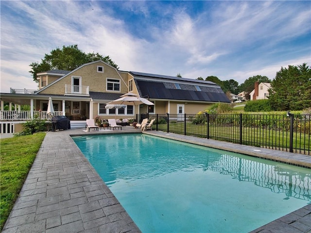 view of swimming pool featuring a fenced in pool, a grill, fence, and a patio