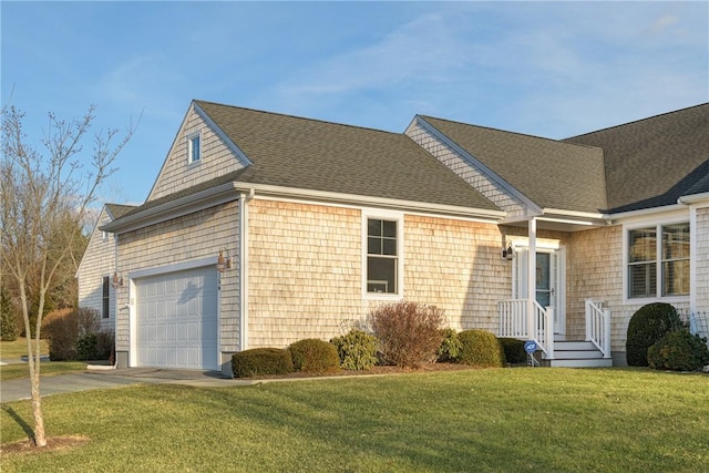 ranch-style home with a garage, driveway, a front lawn, and a shingled roof