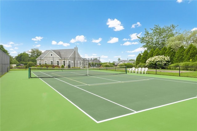 view of sport court featuring fence