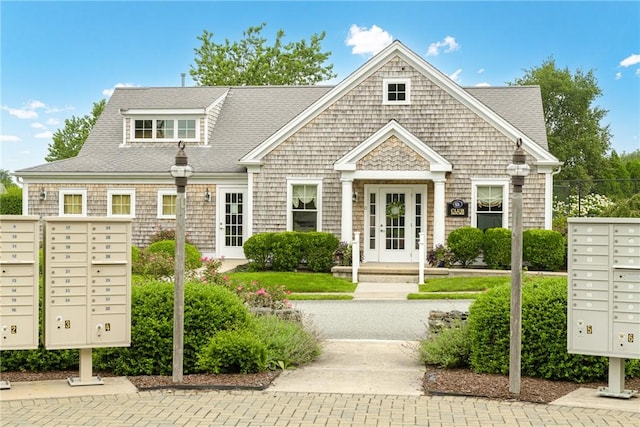 exterior space with a shingled roof