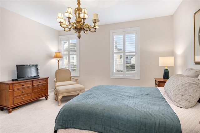 bedroom featuring a chandelier and carpet floors