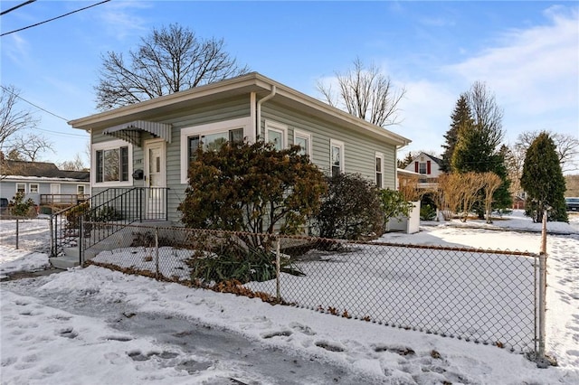 view of front of home featuring fence