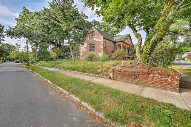 exterior space with brick siding