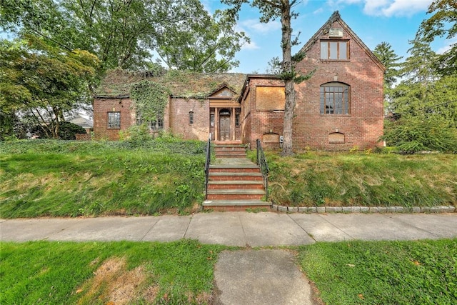 tudor home with brick siding