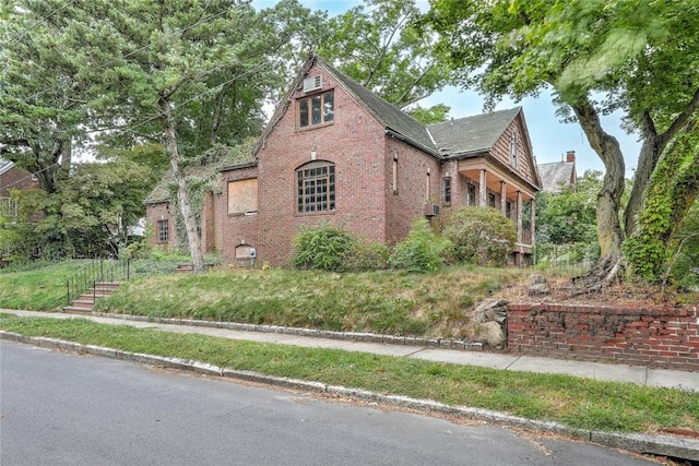 view of property exterior featuring brick siding