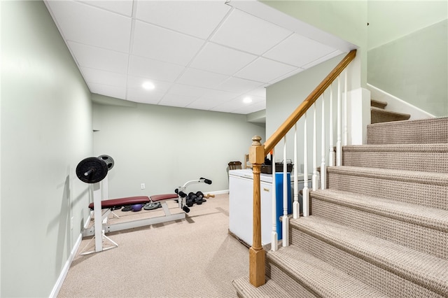 workout area with carpet, a paneled ceiling, baseboards, and recessed lighting