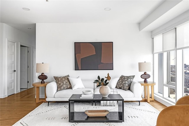 living room featuring light wood finished floors and recessed lighting