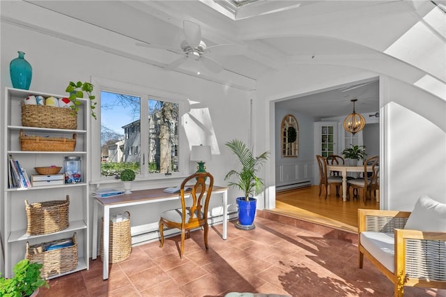 office space with vaulted ceiling with beams, a baseboard radiator, and ceiling fan with notable chandelier