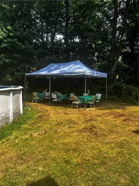 view of yard featuring an outdoor pool