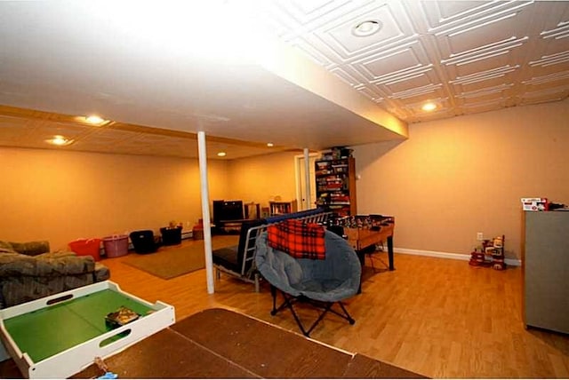 playroom featuring recessed lighting, wood finished floors, an ornate ceiling, and baseboards