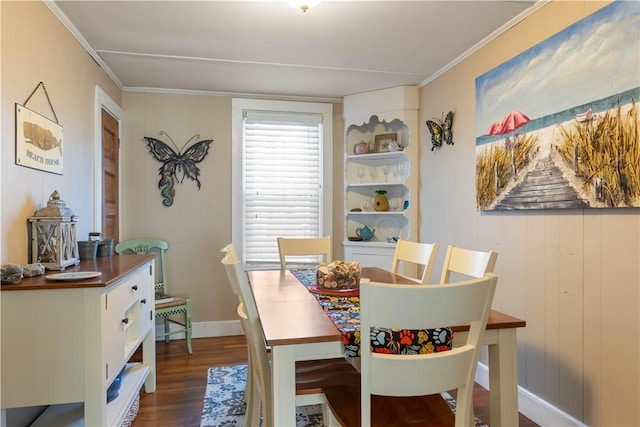 dining room featuring ornamental molding, dark wood-style flooring, and baseboards