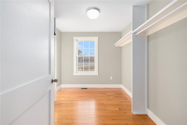 walk in closet featuring light wood-style floors and visible vents