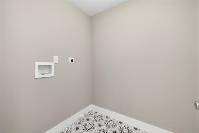 clothes washing area featuring laundry area, baseboards, tile patterned floors, hookup for an electric dryer, and washer hookup