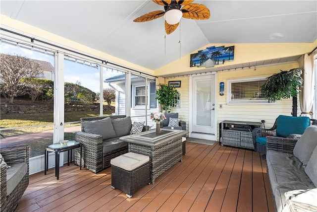 sunroom with vaulted ceiling and ceiling fan