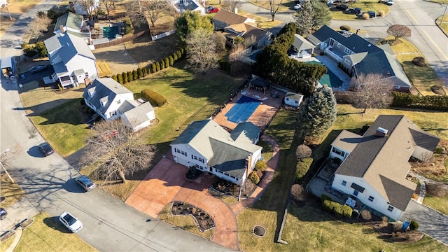 birds eye view of property with a residential view