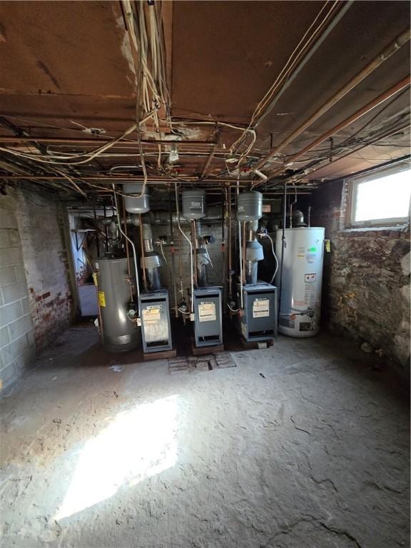 utility room featuring water heater and a heating unit